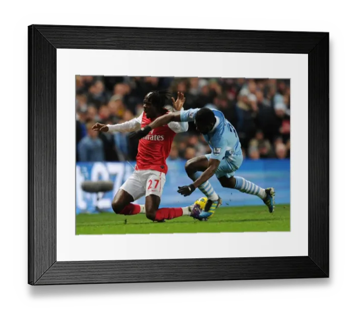 Framed Print : Gervinho vs Kolo Toure: Intense Rivalry at the Etihad (Manchester City vs Arsenal, 2011-12) Framed Print : Gervinho vs Kolo Toure: Intense Rivalry at the Etihad (Manchester City vs Arsenal, 2011-12)