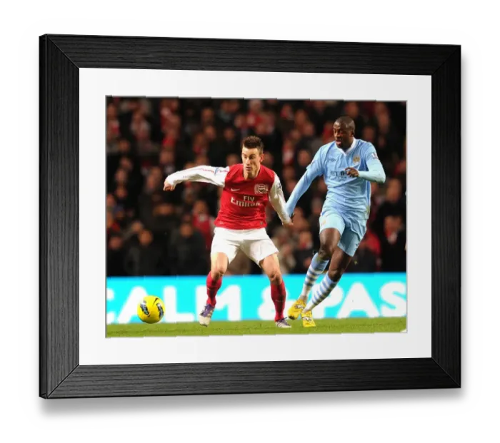 Framed Print : Arsenal's Koscielny Battles Past Yaya Toure in Manchester City Showdown (2011-12 Premier League)