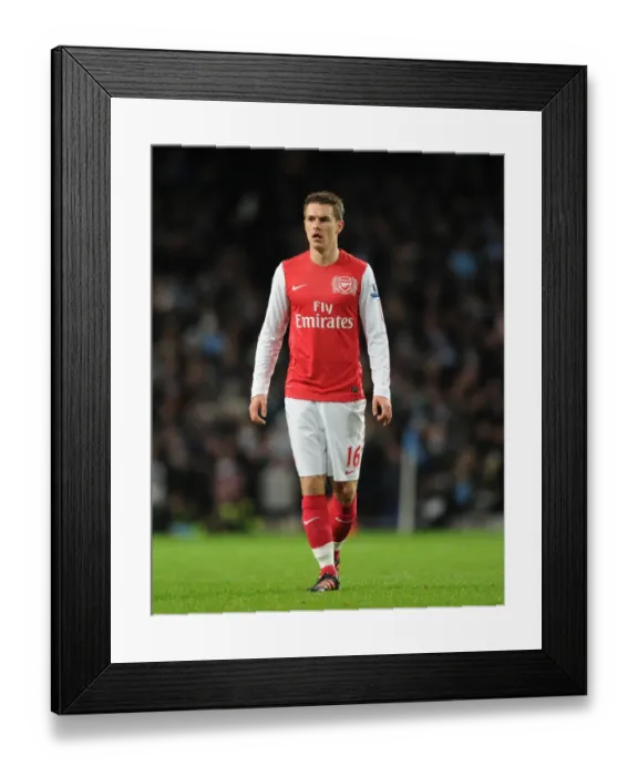 Framed Print : Arsenal's Aaron Ramsey Faces Manchester City in Premier League Clash (2011-12) Framed Print : Arsenal's Aaron Ramsey Faces Manchester City in Premier League Clash (2011-12)
