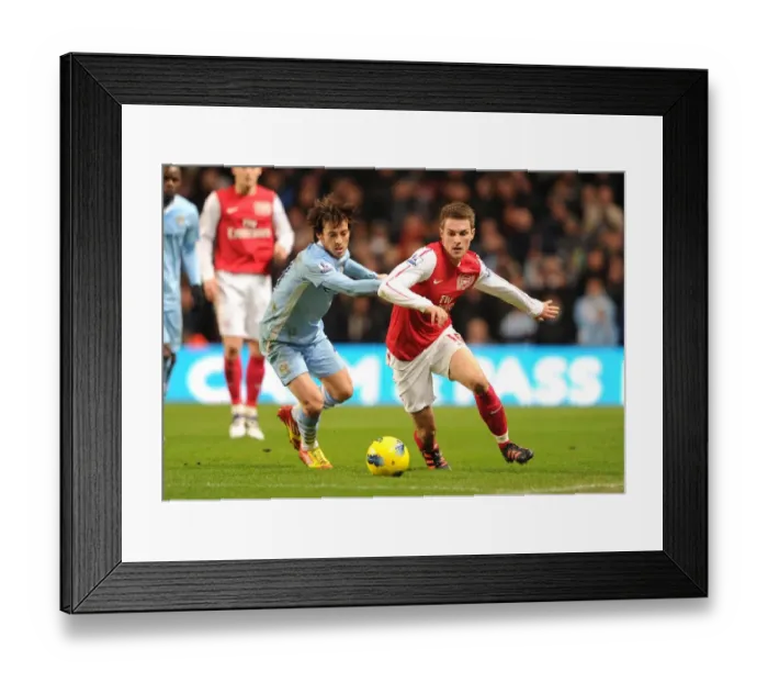 Framed Print : Clash of the Midfield Maestros: Ramsey vs Silva, Manchester City vs Arsenal, Premier League 2011-12 Framed Print : Clash of the Midfield Maestros: Ramsey vs Silva, Manchester City vs Arsenal, Premier League 2011-12