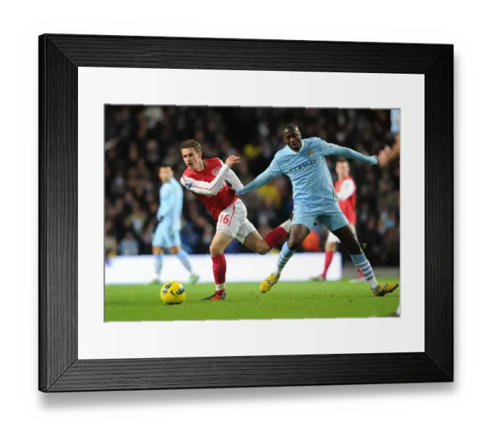 Framed Print : Clash of the Midfield Titans: Ramsey vs. Yaya Toure, Premier League Showdown, Arsenal vs. Manchester City, December 2011