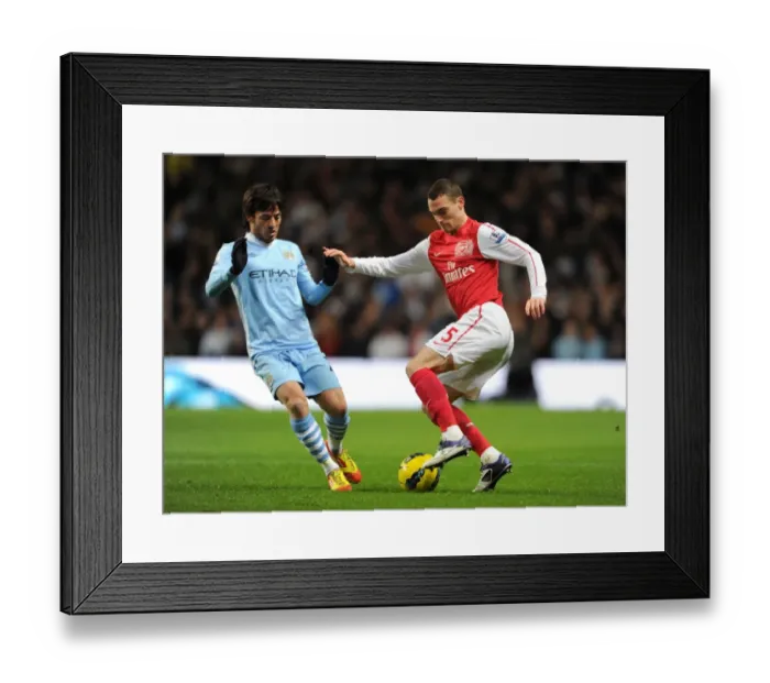 Framed Print : Thomas Vermaelen vs. David Silva: Clash of the Titans - Manchester City vs. Arsenal, Premier League 2011-12 Framed Print : Thomas Vermaelen vs. David Silva: Clash of the Titans - Manchester City vs. Arsenal, Premier League 2011-12