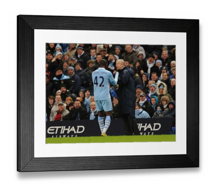 Framed Print : Arsene Wenger and Yaya Toure: A Light-Hearted Moment Amidst the Manchester City vs. Arsenal Rivalry (2011-12)
