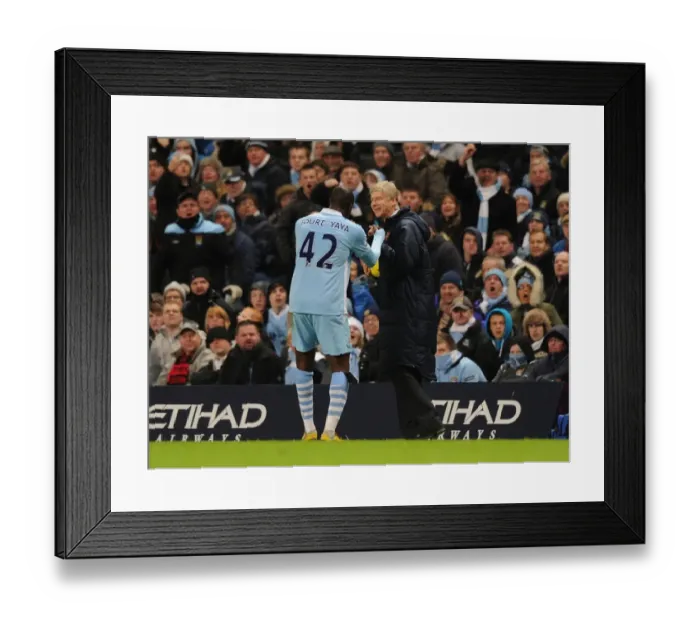 Framed Print : Arsene Wenger and Yaya Toure: A Moment of Camaraderie Amidst Rivalry (Manchester City vs Arsenal, 2011-12)