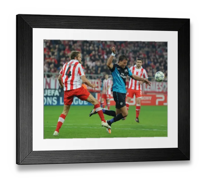 Framed Print : Chamakh vs. Mellberg: A Battle in the UEFA Champions League between Olympiacos and Arsenal