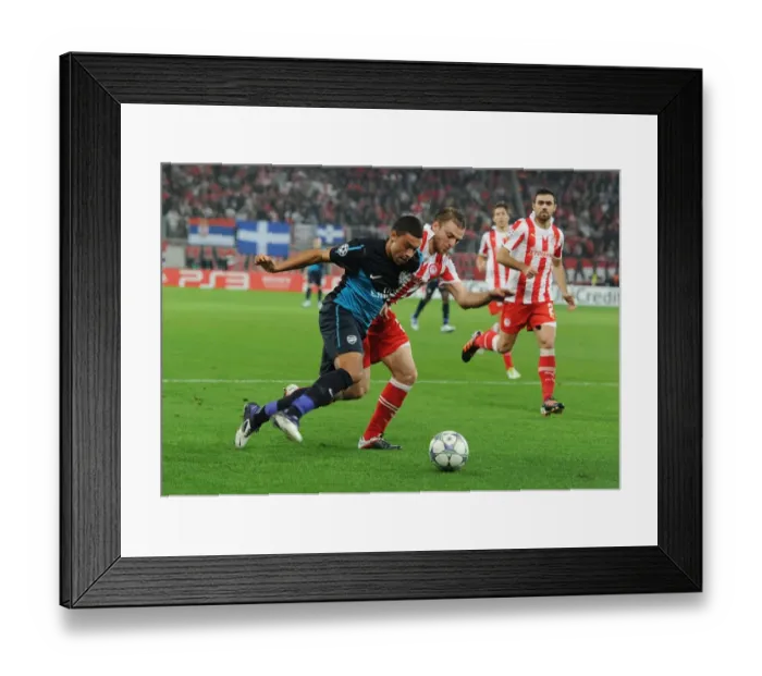 Framed Print : Clash of Champions: Oxlade-Chamberlain vs. Papadopoulos - Olympiacos vs. Arsenal, UEFA Champions League (December 2011)