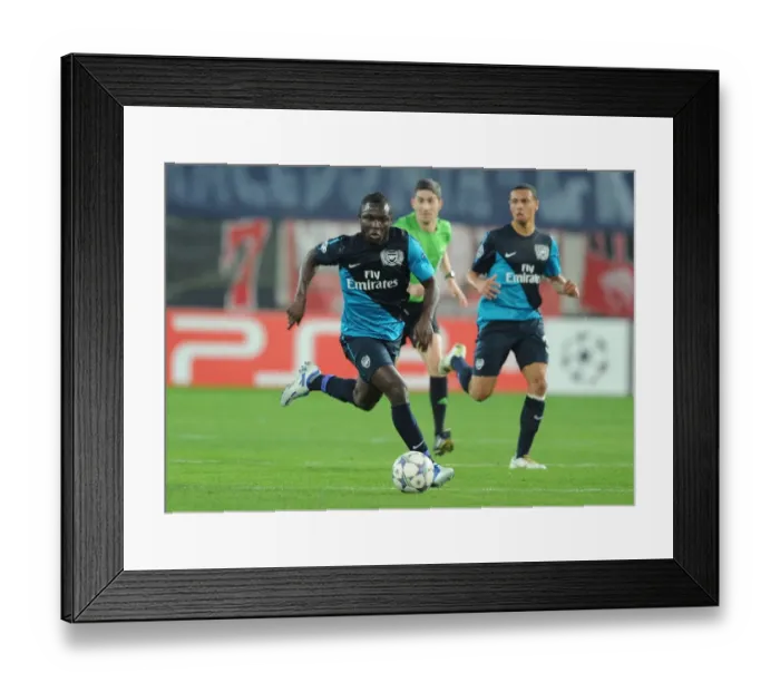 Framed Print : Emmanuel Frimpong: In Action for Arsenal in the 2011-12 UEFA Champions League Match against Olympiacos Framed Print : Emmanuel Frimpong: In Action for Arsenal in the 2011-12 UEFA Champions League Match against Olympiacos