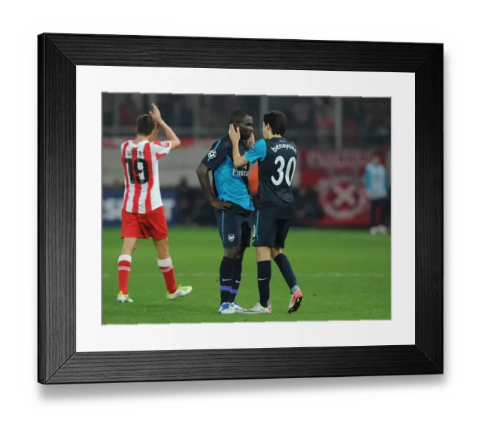Framed Print : Arsenal's Benayoun and Frimpong in Deep Conversation during Olympiacos Clash (2011-12) Framed Print : Arsenal's Benayoun and Frimpong in Deep Conversation during Olympiacos Clash (2011-12)