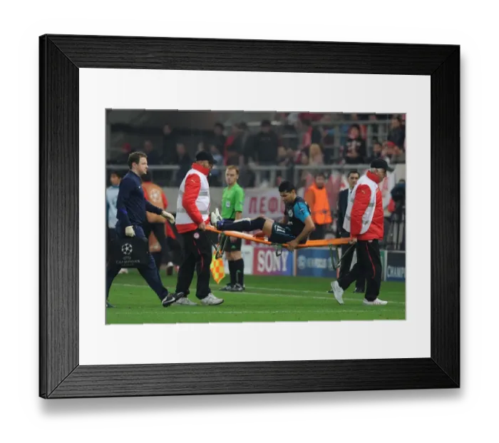 Framed Print : Andre Santos Carried Off Injured: Olympiacos vs Arsenal, UEFA Champions League, 2011 Framed Print : Andre Santos Carried Off Injured: Olympiacos vs Arsenal, UEFA Champions League, 2011