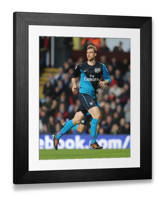 Framed Print : Per Mertesacker Focuses in Aston Villa vs Arsenal Premier League Clash (2011-12)