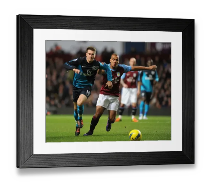 Framed Print : Ramsey vs. Agbonlahor: A Premier League Battle at Villa Park Framed Print : Ramsey vs. Agbonlahor: A Premier League Battle at Villa Park