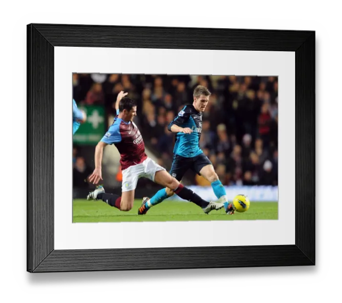 Framed Print : Arsenal's Aaron Ramsey Outmuscles Aston Villa's Ciaran Clark in Premier League Clash