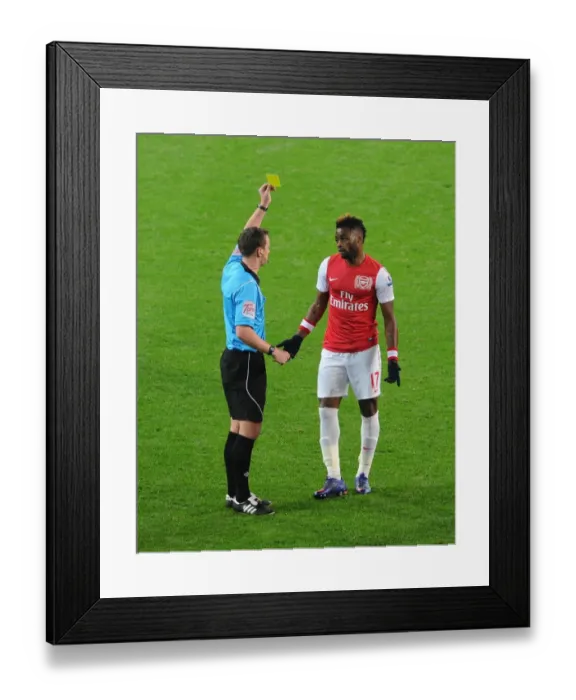 Framed Print : Arsenal's Alex Song Shown Yellow Card by Referee Stuart Attwell (2011-2012) Framed Print : Arsenal's Alex Song Shown Yellow Card by Referee Stuart Attwell (2011-2012)
