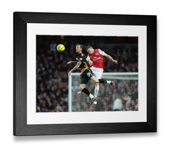 Framed Print : Arsenal's Thomas Vermaelen Heads Ball Away from Steven Fletcher (2011-2012) Framed Print : Arsenal's Thomas Vermaelen Heads Ball Away from Steven Fletcher (2011-2012)