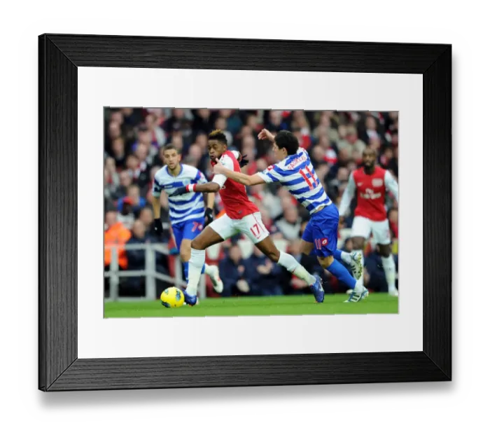 Framed Print : Arsenal's Alex Song Clashes with QPR's Alejandro Faurlin during Premier League Match Framed Print : Arsenal's Alex Song Clashes with QPR's Alejandro Faurlin during Premier League Match