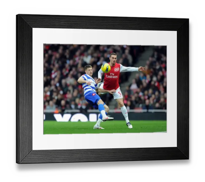 Framed Print : Arsenal vs. Queens Park Rangers: Vermaelen vs. Mackie in Intense Premier League Clash