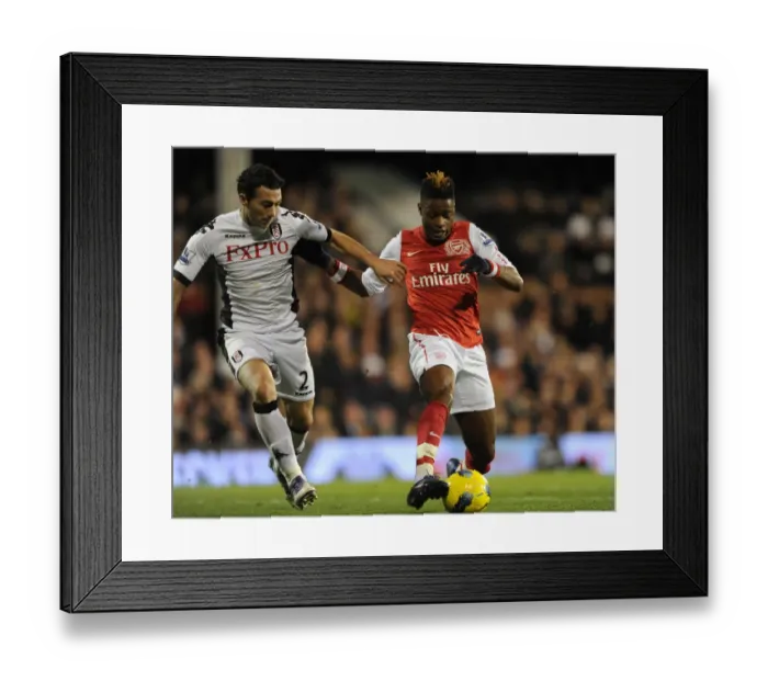 Framed Print : Alex Song (Arsenal) Stephen Kelly (Fulham). Fulham 2: 1 Arsenal. Barclays Premier League Framed Print : Alex Song (Arsenal) Stephen Kelly (Fulham). Fulham 2: 1 Arsenal. Barclays Premier League