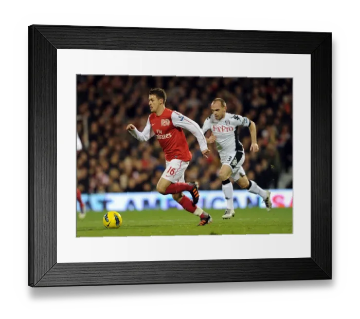 Framed Print : Aaron Ramsey Outpaces Danny Murphy: Fulham vs. Arsenal, Premier League 2011-12 Framed Print : Aaron Ramsey Outpaces Danny Murphy: Fulham vs. Arsenal, Premier League 2011-12