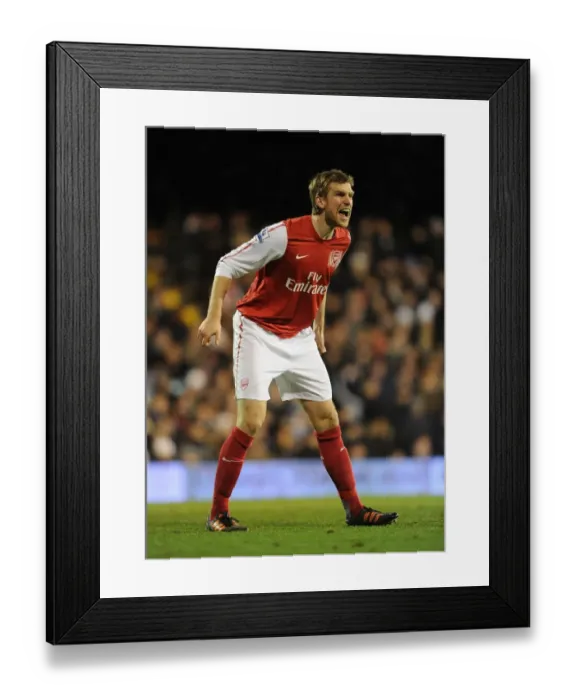 Framed Print : Per Mertesacker Focuses at Craven Cottage: Fulham vs Arsenal, Premier League 2011-12 Framed Print : Per Mertesacker Focuses at Craven Cottage: Fulham vs Arsenal, Premier League 2011-12