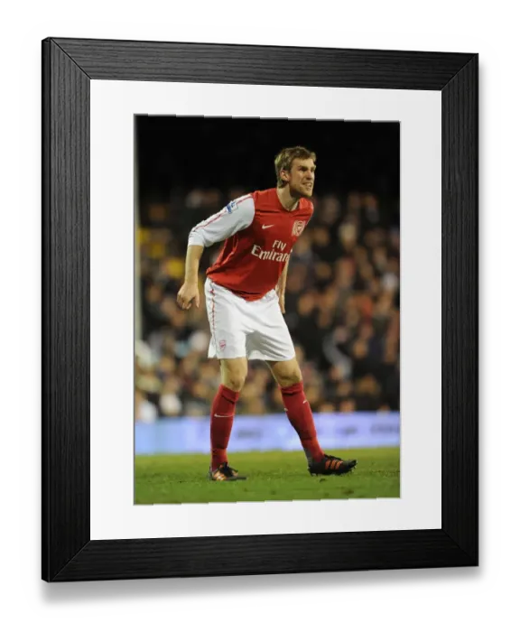 Framed Print : Per Mertesacker Focuses in Fulham vs Arsenal Premier League Clash (2011-12)