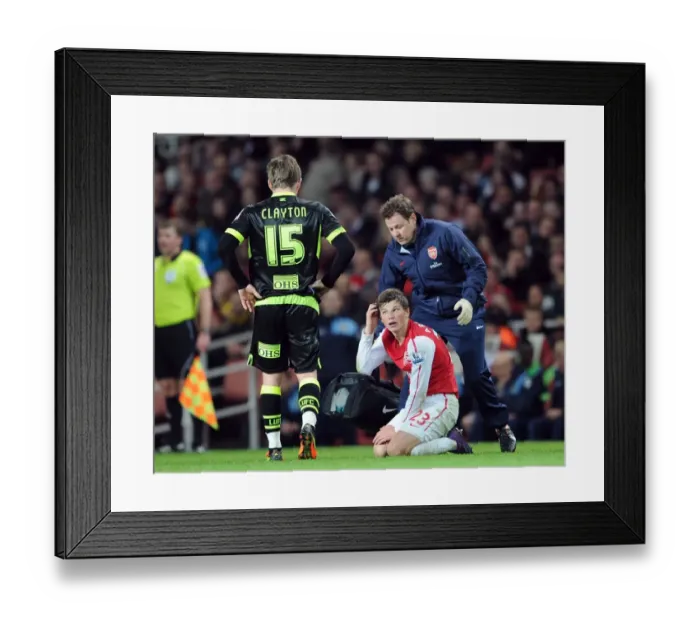 Framed Print : Arsenal's Andrey Arshavin Receives Treatment from Physio during Arsenal v Leeds United FA Cup Match Framed Print : Arsenal's Andrey Arshavin Receives Treatment from Physio during Arsenal v Leeds United FA Cup Match