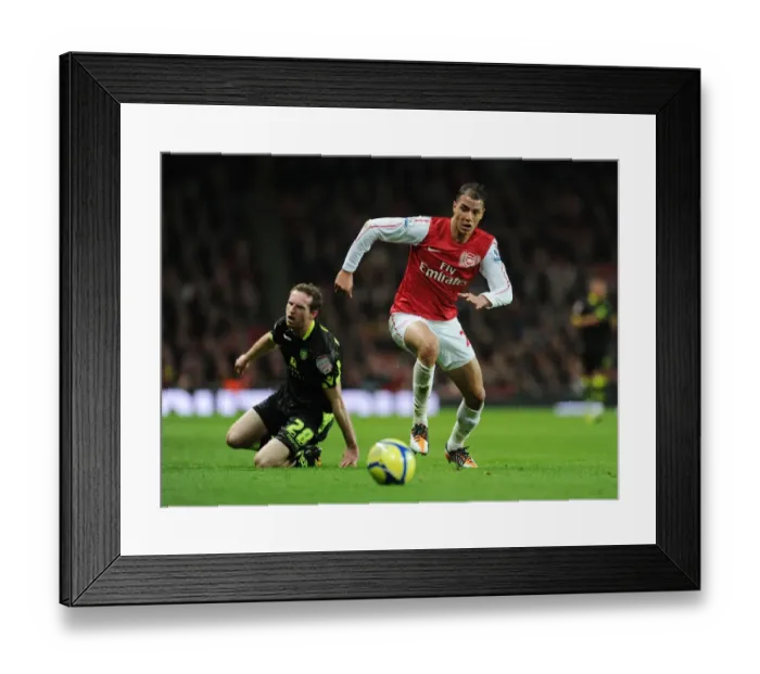 Framed Print : Arsenal's Marouane Chamakh Breaks Past Leeds Aidan White in FA Cup Clash Framed Print : Arsenal's Marouane Chamakh Breaks Past Leeds Aidan White in FA Cup Clash