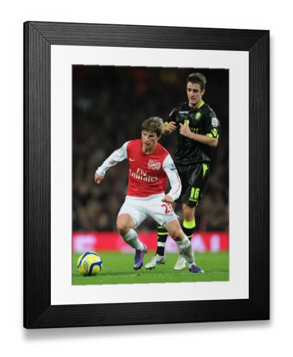 Framed Print : Arshavin Breaks Past Leeds Pugh in FA Cup Clash: Arsenal vs Leeds United (2011-12)