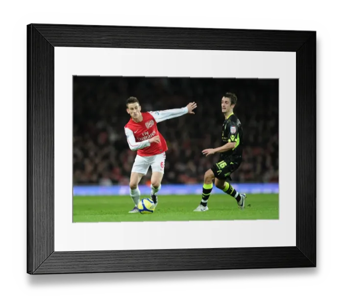 Framed Print : Arsenal's Koscielny Brakes Past Leeds Pugh in FA Cup Clash