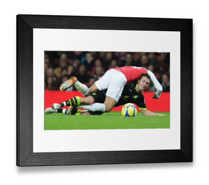 Framed Print : Arsenal vs Leeds United: FA Cup Clash - Chamakh vs Pugh's Intense Battle Framed Print : Arsenal vs Leeds United: FA Cup Clash - Chamakh vs Pugh's Intense Battle