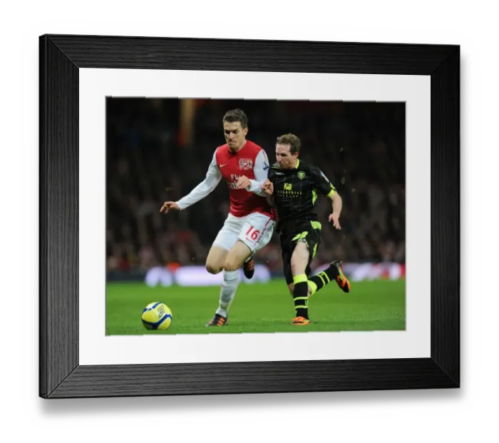 Framed Print : Arsenal's Aaron Ramsey Scores Past Leeds Aidan White in FA Cup Clash Framed Print : Arsenal's Aaron Ramsey Scores Past Leeds Aidan White in FA Cup Clash