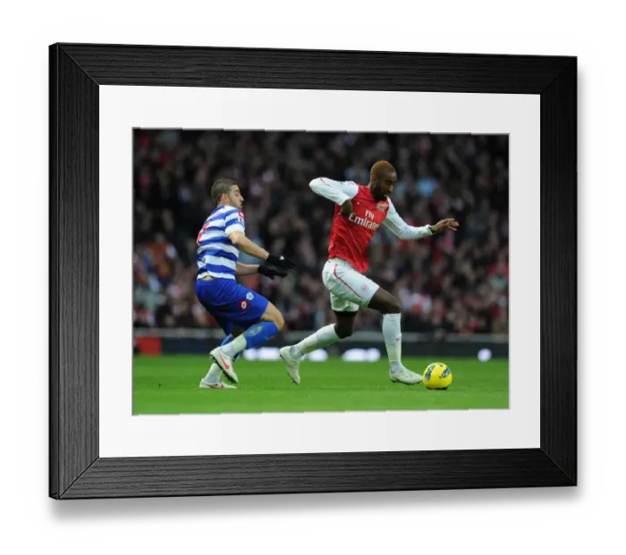 Framed Print : Arsenal's Johan Djourou Outmaneuvers QPR's Adel Taarabt during Premier League Clash Framed Print : Arsenal's Johan Djourou Outmaneuvers QPR's Adel Taarabt during Premier League Clash