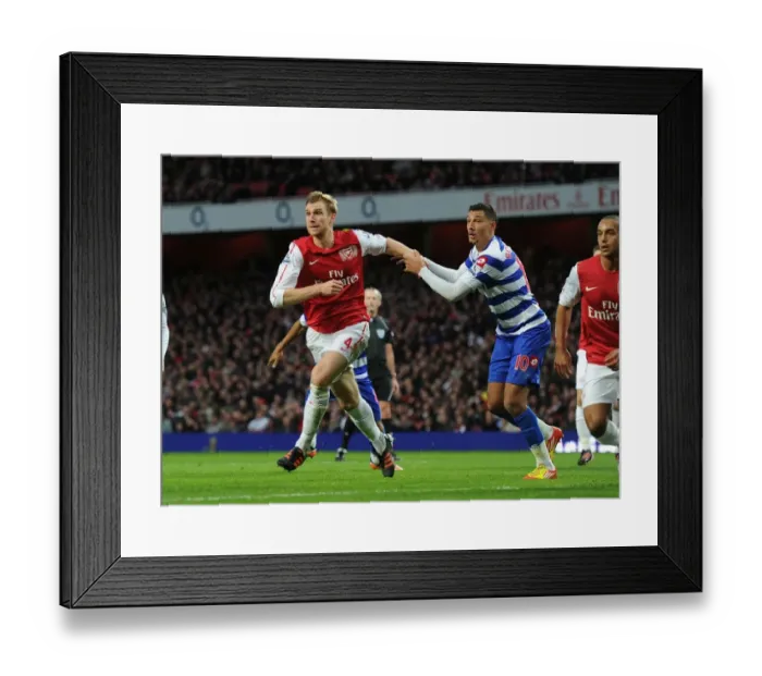Framed Print : Intense Clash: Mertesacker vs. Bothroyd at Arsenal vs. QPR