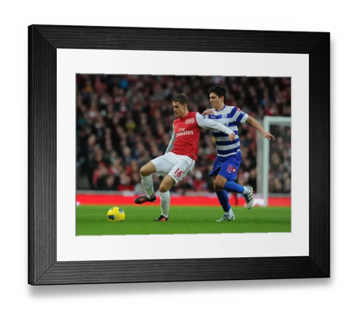 Framed Print : Arsenal's Aaron Ramsey Outmaneuvers QPR's Alejandro Faurlin
