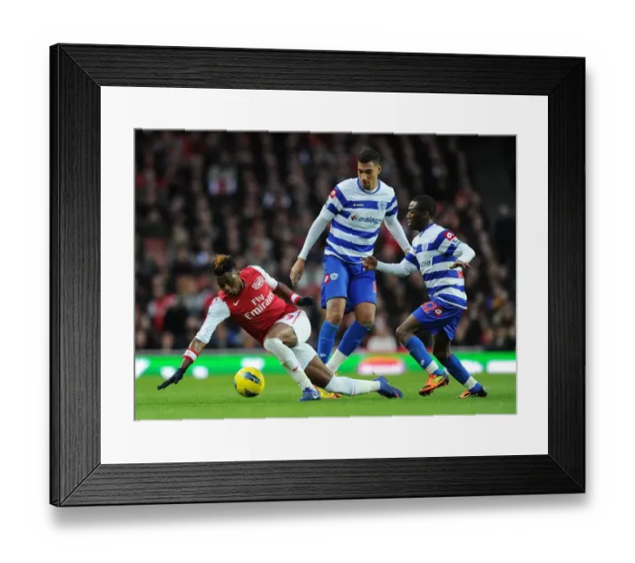 Framed Print : Arsenal's Alex Song Breaks Through QPR Defenders During Premier League Clash Framed Print : Arsenal's Alex Song Breaks Through QPR Defenders During Premier League Clash
