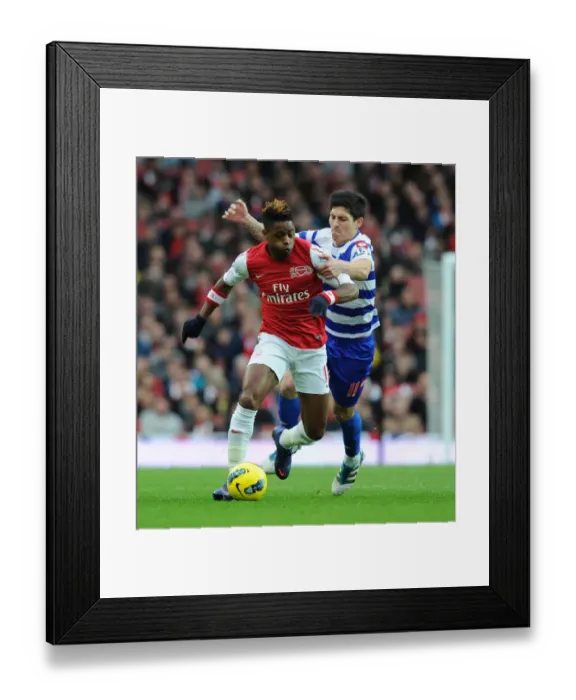 Framed Print : Clash of Midfield Titans: Alex Song vs. Alejandro Faurlin, Arsenal vs. Queens Park Rangers, Premier League, December 2011 Framed Print : Clash of Midfield Titans: Alex Song vs. Alejandro Faurlin, Arsenal vs. Queens Park Rangers, Premier League, December 2011