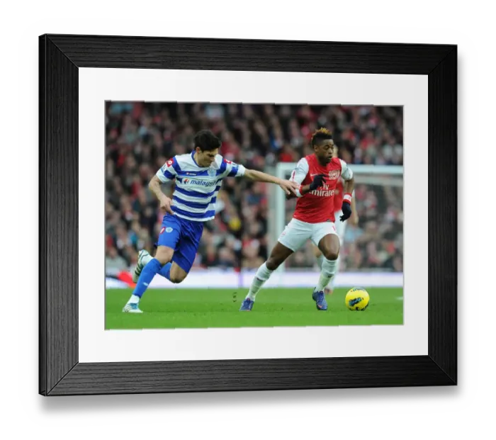 Framed Print : Alex Song Outmaneuvers Alejandro Faurlin in Arsenal's Victory over Queens Park Rangers