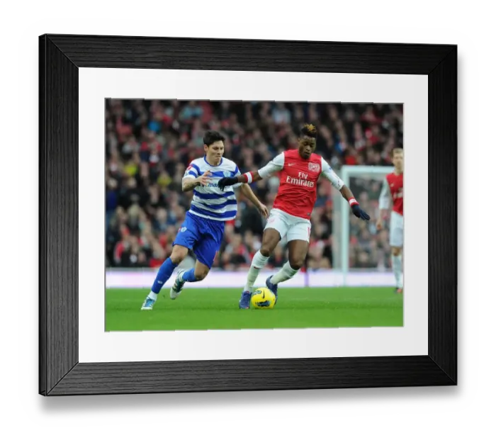 Framed Print : Clash of Midfield Titans: Song vs. Faurlin, Arsenal vs. QPR, Premier League 2011-12 Framed Print : Clash of Midfield Titans: Song vs. Faurlin, Arsenal vs. QPR, Premier League 2011-12