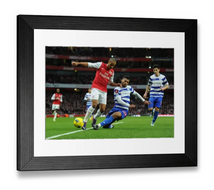 Framed Print : Theo Walcott vs. Armand Traore: A Battle in the Arsenal v Queens Park Rangers Premier League Clash (December 2011) Framed Print : Theo Walcott vs. Armand Traore: A Battle in the Arsenal v Queens Park Rangers Premier League Clash (December 2011)