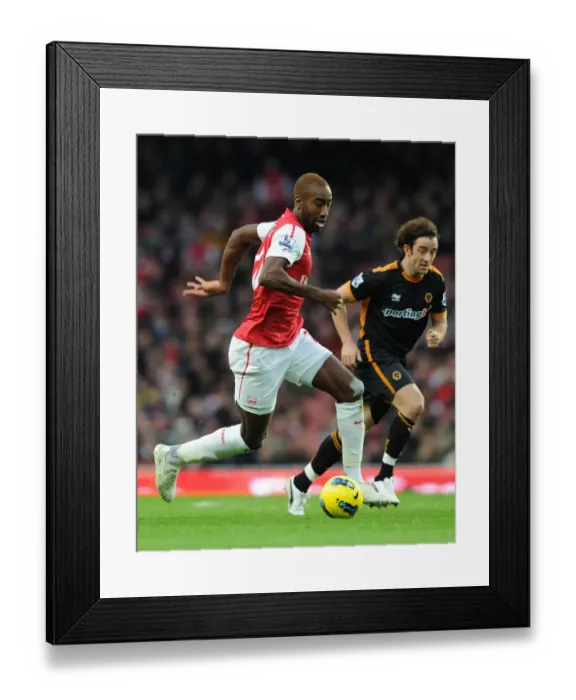 Framed Print : Arsenal's Johan Djourou Breaks Past Wolverhampton's Stephen Hunt during the 2011-2012 Premier League Match