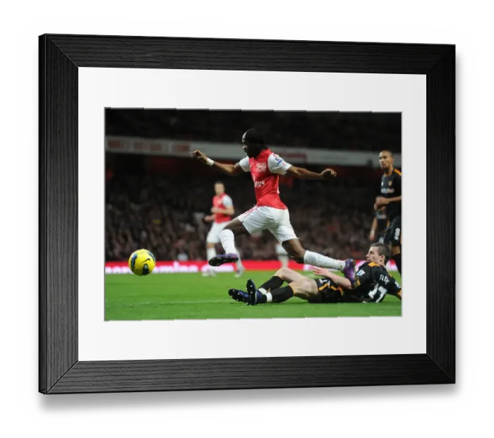 Framed Print : Arsenal's Gervinho Outmaneuvers Wolves Forde in 2011-2012 Premier League Clash Framed Print : Arsenal's Gervinho Outmaneuvers Wolves Forde in 2011-2012 Premier League Clash
