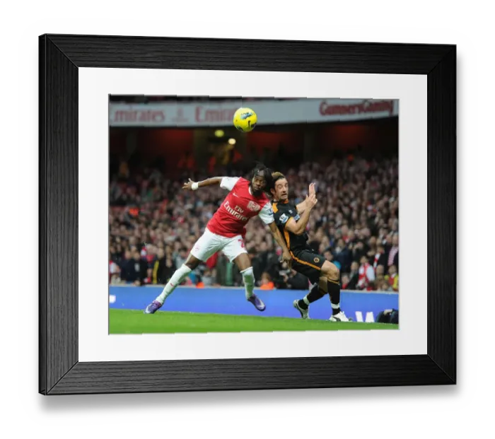 Framed Print : Arsenal vs. Wolverhampton Wanderers: Gervinho vs. Stephen Hunt Clash in Premier League Match