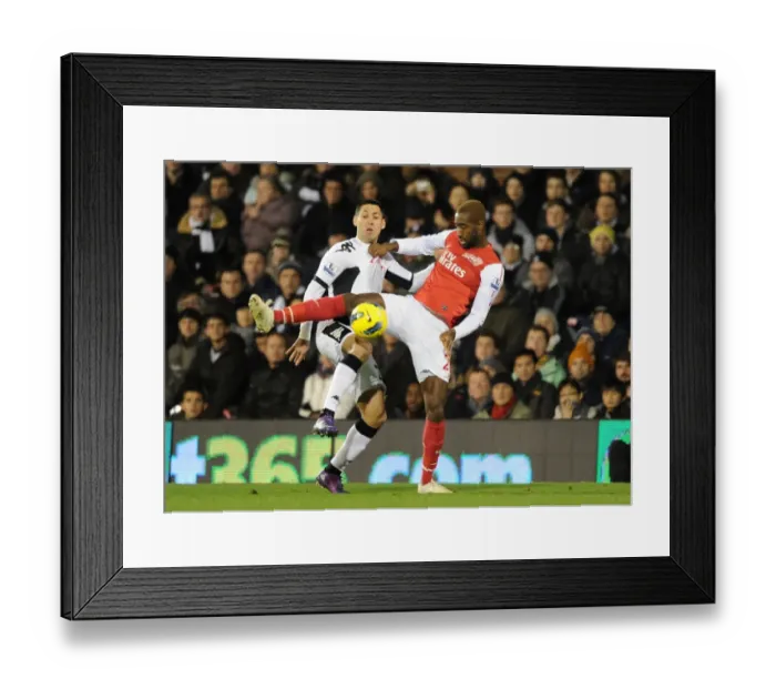 Framed Print : Intense Clash: Djourou vs. Dempsey, Arsenal vs. Fulham, Premier League, 2012