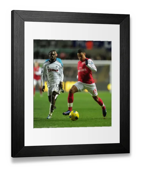 Framed Print : Arsenal's Alex Oxlade-Chamberlain Outmaneuvers Swansea's Nathan Dyer Framed Print : Arsenal's Alex Oxlade-Chamberlain Outmaneuvers Swansea's Nathan Dyer