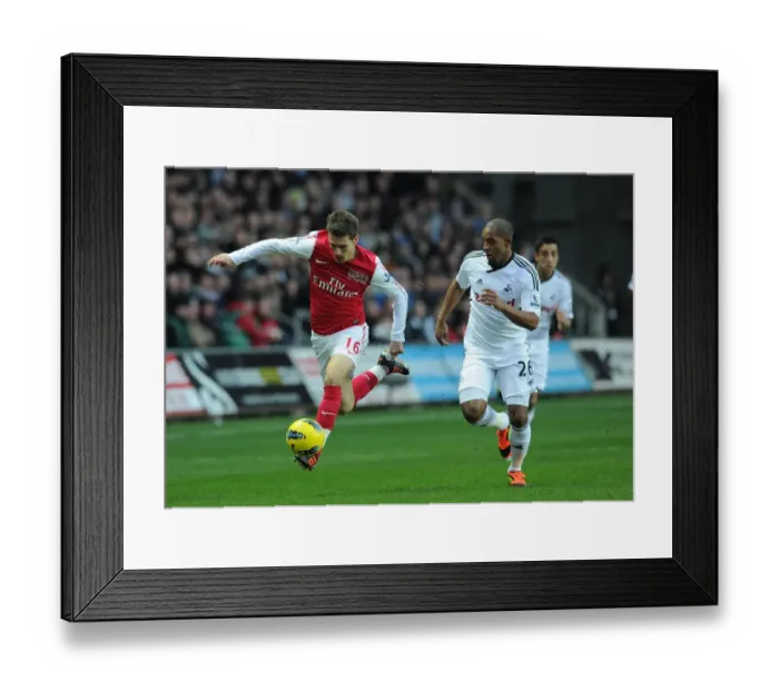 Framed Print : Clash of Midfield Titans: Ramsey vs. Agustien, Swansea City vs. Arsenal, 2012 Framed Print : Clash of Midfield Titans: Ramsey vs. Agustien, Swansea City vs. Arsenal, 2012