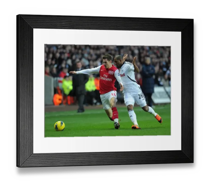 Framed Print : Clash of Midfield Titans: Ramsey vs. Agustien, Arsenal vs. Swansea City, Premier League, 2012 Framed Print : Clash of Midfield Titans: Ramsey vs. Agustien, Arsenal vs. Swansea City, Premier League, 2012
