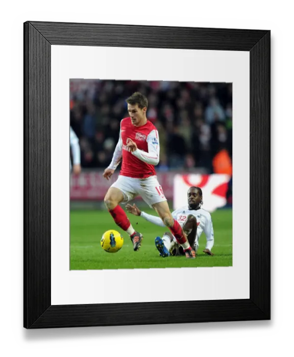 Framed Print : Arsenal's Aaron Ramsey Battles Nathan Dyer of Swansea for Ball Possession in Premier League Clash