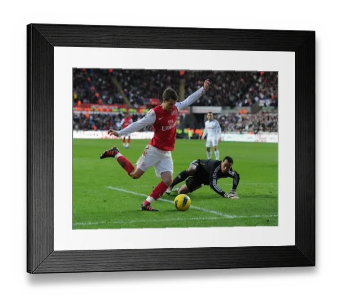 Framed Print : Aaron Ramsey vs. Michel Vorm: Battle at the Swansea Goal
