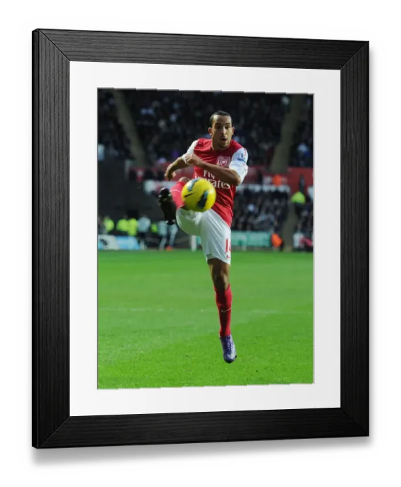 Framed Print : Theo Walcott in Action: Swansea City vs. Arsenal, Premier League 2011-12 Framed Print : Theo Walcott in Action: Swansea City vs. Arsenal, Premier League 2011-12