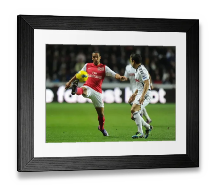 Framed Print : Theo Walcott vs. Neil Taylor: A Footballing Battle at Swansea City (2011-12) Framed Print : Theo Walcott vs. Neil Taylor: A Footballing Battle at Swansea City (2011-12)