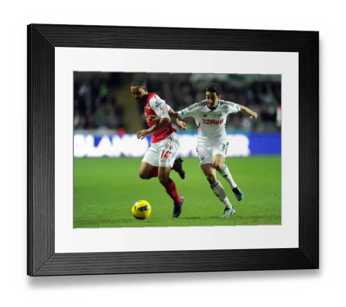 Framed Print : Theo Walcott vs. Neil Taylor: A Football Rivalry Erupts at Swansea City (2011-12)